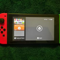 Neon Nintendo Switch w/ games & cartridge holdere
