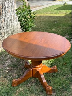 Pedestal wood dining table