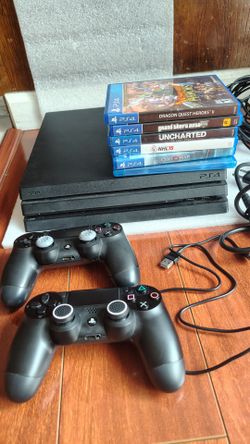1 TB PS4 pro with two controllers and six games