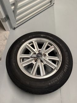 Michelin Defender 215/65R16 Tire on Ford Rim