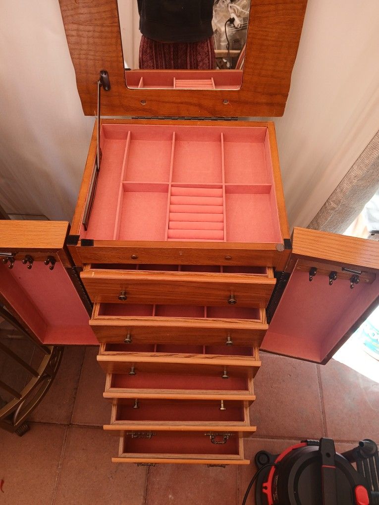 Vintage oak jewelry armoire.