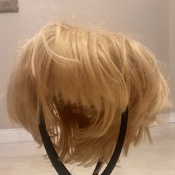  The Dragon Ball Z Super Sayian Goku Yellow Costume Cosplay Wig is a high-quality polyester wig designed for cosplay enthusiasts. This wig features a 