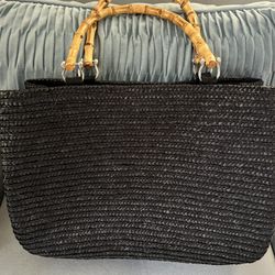 Like new black woven tote bag with bamboo handles. Like new condition!
