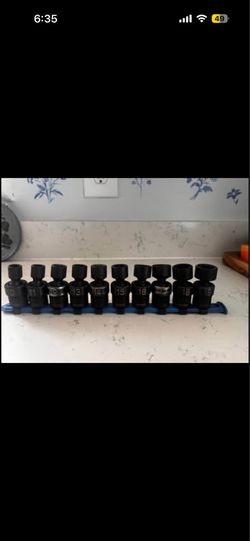 MATCO 3/8 metric swivel impact sockets on a storage rail