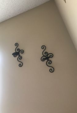 Small black metal candle holders.