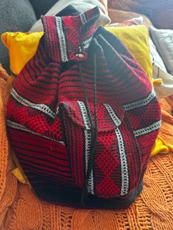 The Artesanías Pinzón woven drawstring backpack