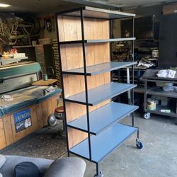 Shelving unit on wheels.