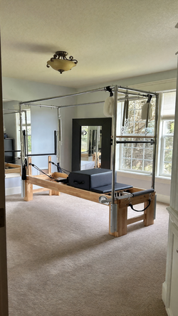 Pilates Reformer with Trapeze Tower in like new condition