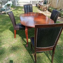 Dining Room Table And Four Chairs/ Solid Wood Table With Two Leaf Extension And Four Leather Chairs 