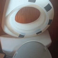 Seat riser for the toilet.