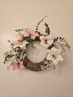 Two beautiful wreath and a bird vase with flowers