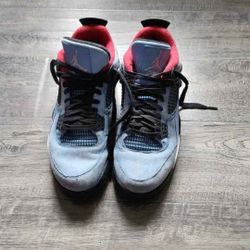 Jordan x Travis Scott Air Jordan 4 Retro "Cactus Jack" sneakers in a University Blue, Varsity Red, and Black colorway. 