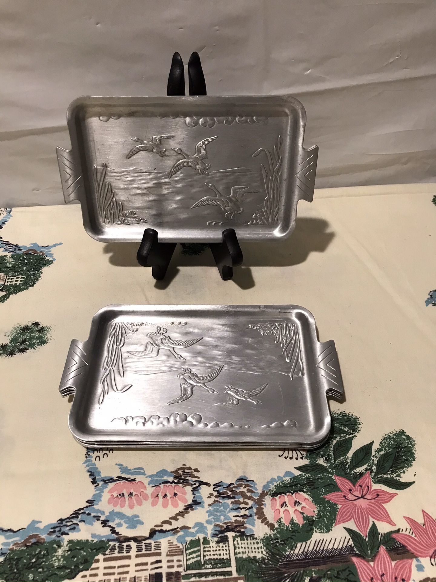 Vintage set of 8 bested aluminum silver trays with birds scenery art.