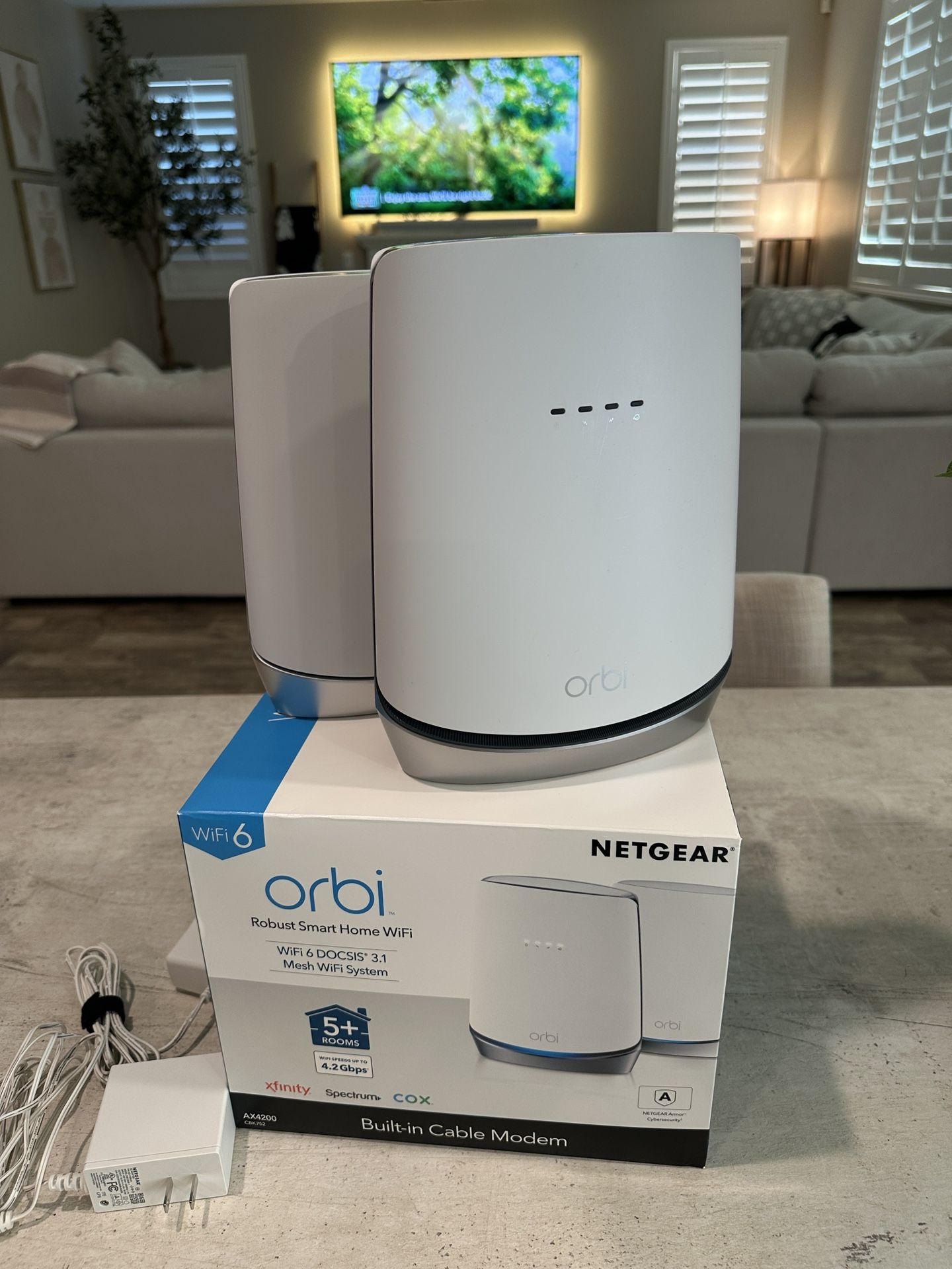 NETGEAR Orbi WiFi 6 Cable Modem Router + Satellite Extender, AX4200, Covers 5000 sq. ft., 40+ Devices