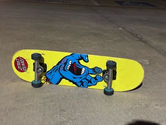 santa cruz blue hand skateboard