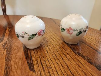 Lovely antique china salt and pepper shakers with classic rose design.