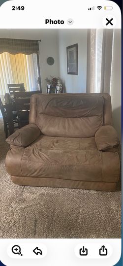 Used over sized recliner auto push button $200 or best offer call Teresa (contact info removed)