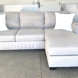 Light Gray Sectional with Reversible Chaise