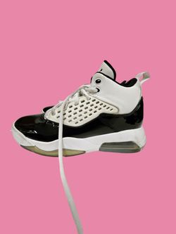 Women’s size 6.5 Nike Air Jordan Maxin 200 White Ice sneakers featuring a black patent leather mudguard and white upper