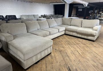 Delivery available Ashley u shape sectional couch