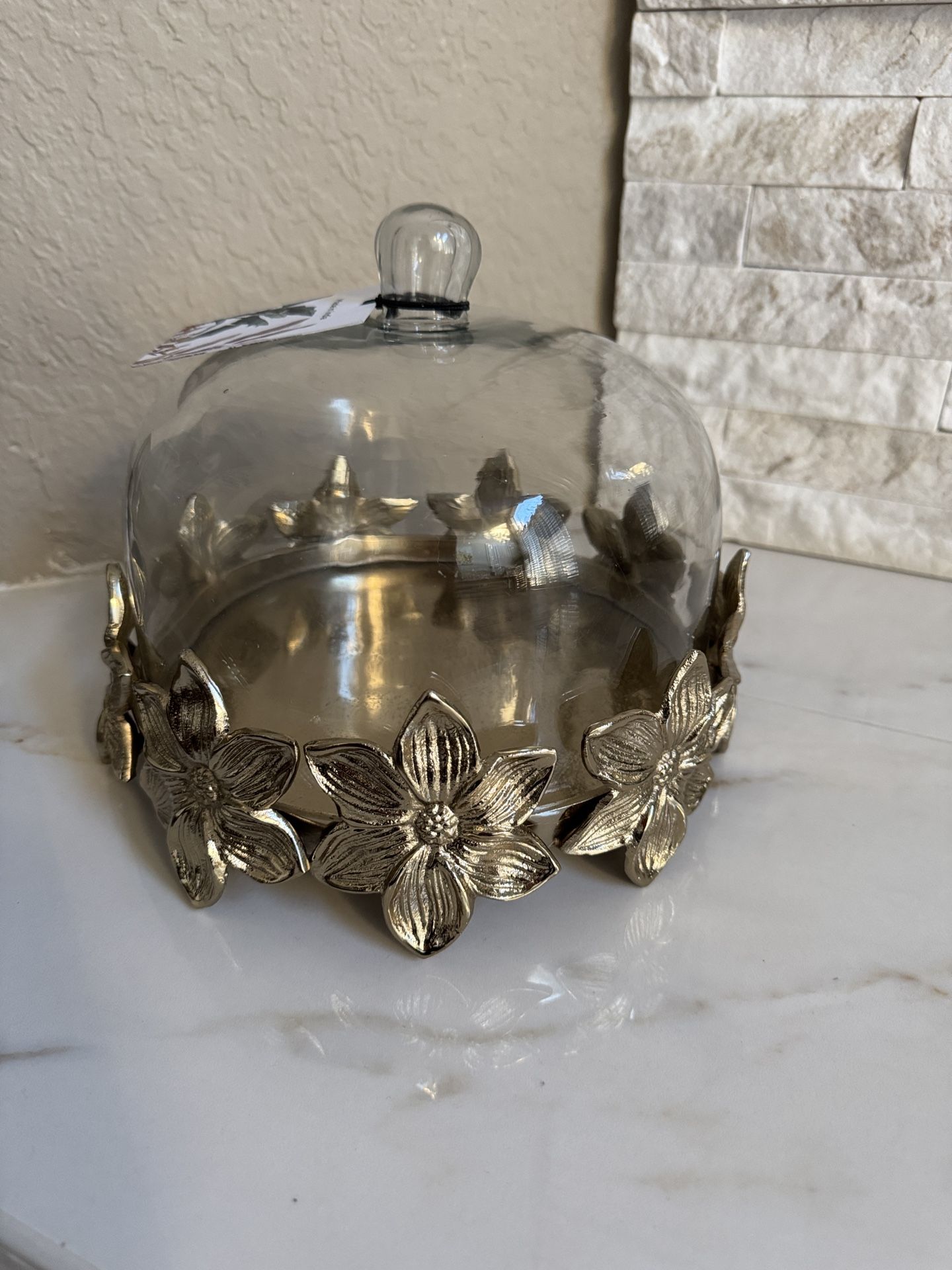 Metal and glass cake stand with dome