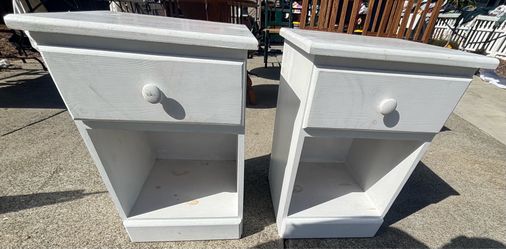 Two matching wooden nightstands with drawer
