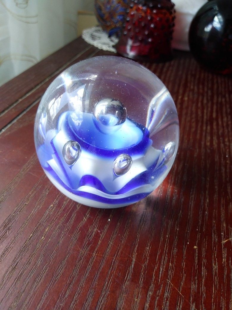 Glass Paperweight With Blue And White Flower Inside. Also 7 Bubbles.