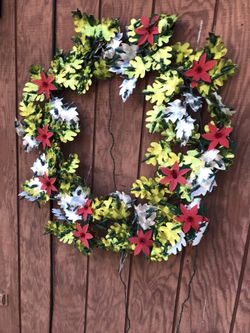 Two large metallic Christmas wreaths