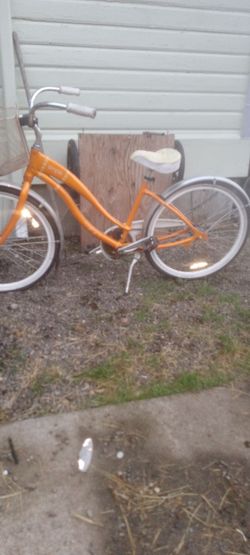 Giant orange step through  beach cruiser