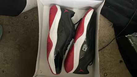 Air Jordan 11 CMFT Low in the iconic "Bred" (Black/Gym Red/White) colorway