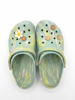 Crocs - sky blue with flower plugs.  Size 7 men’s 9 women’s