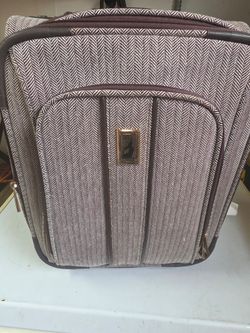 Small portable travel bag from London Vogue, almost new, clean and sanitized