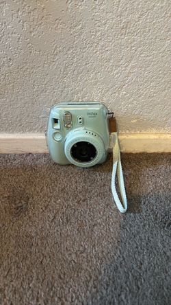Light blue Polaroid camera with clear case