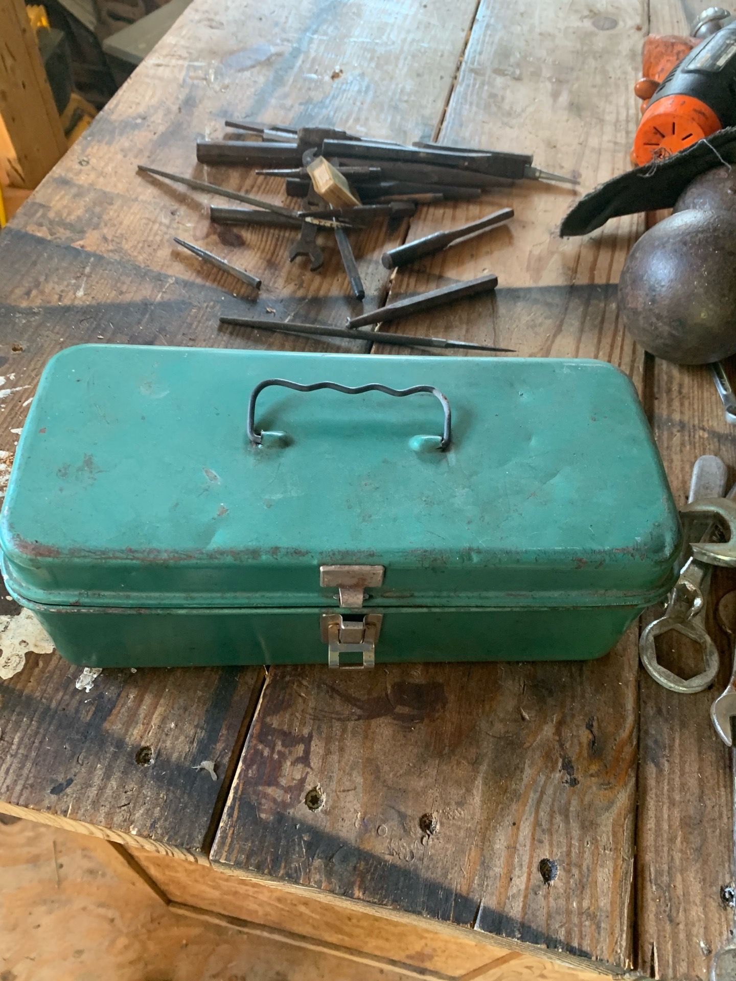 This is a vintage Union green metal toolbox.