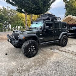 2011 Jeep Wrangler 4 Door 2.5 Inch Lift On Black Rhinos 35’s 3.8L V6