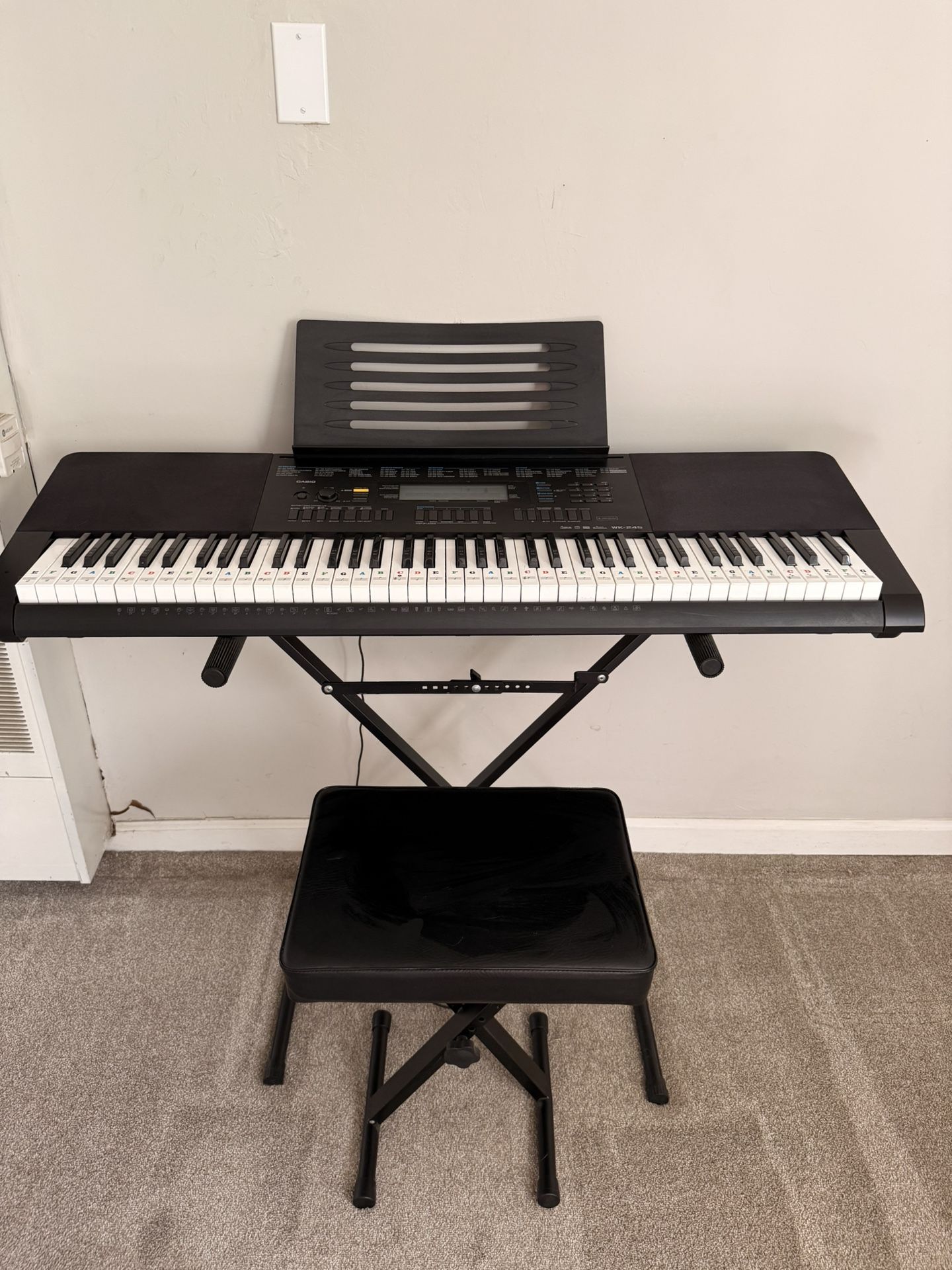 Casio WK-245 76-Key Keyboard + X-Stand + Padded Bench — $200