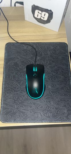 Gaming mouse with a mouse pad