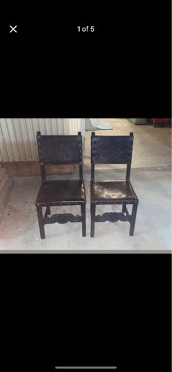 Pair of antique tooled leather Spanish colonial chairs, walnut