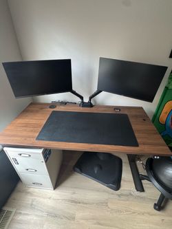 Uplift V2 Commercial Standing Desk 60x30 Walnut + Dual Monitor Arm – Excellent Condition