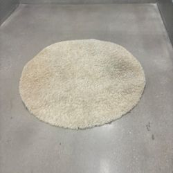 48 inches round beige shag rug.. $25