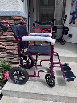 Beautiful new RED  Transfer Chair,Patient/caregiver model- easy to steer, fold. Brand New.