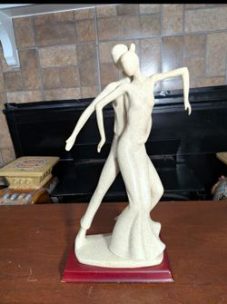 Sandstone resin sculpture of two graceful figures captured in a fluid, dynamic dance pose
