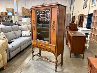 Vintage Wooden Jacobean Style Hutch with Glass Door and Decorative Trestle Base