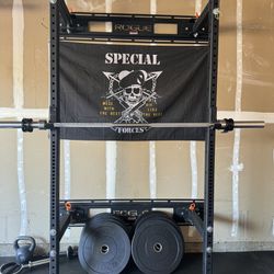 Rogue half rack with weights.