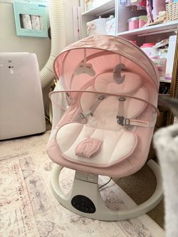 Pink baby swing