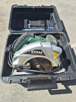 OSH branded 14-amp circular saw, likely featuring a laser guide for increased cutting accuracy.