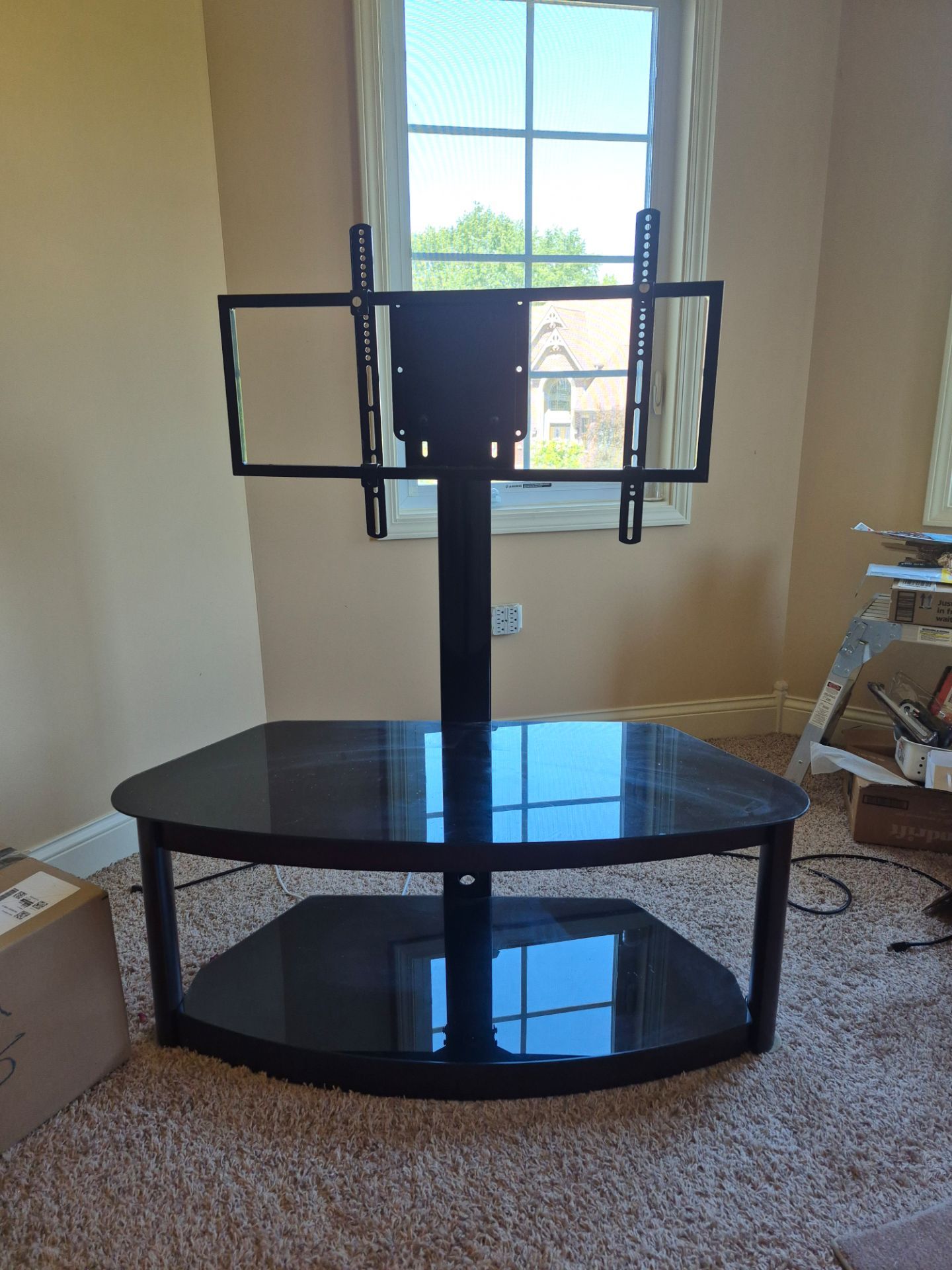 Black glass TV stand with adjustable mount