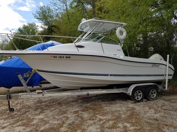 2003 seaswirl stripper 2300 walk around with evinrude 225 e-tec motor and venture twin axle trailer
