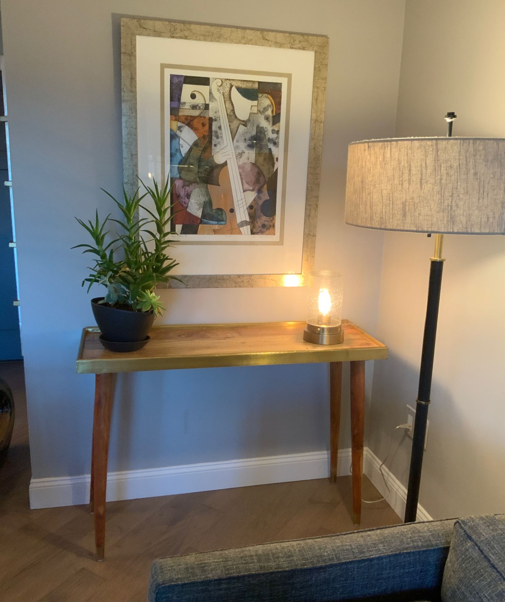 Mid Century console table with gold leaf accent trim
