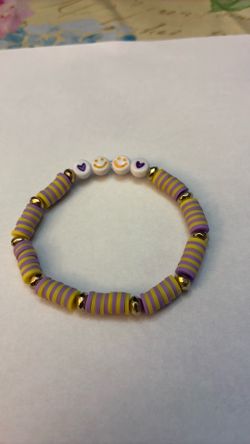 Purple and Yellow with purple heart and yellow happy face beads.